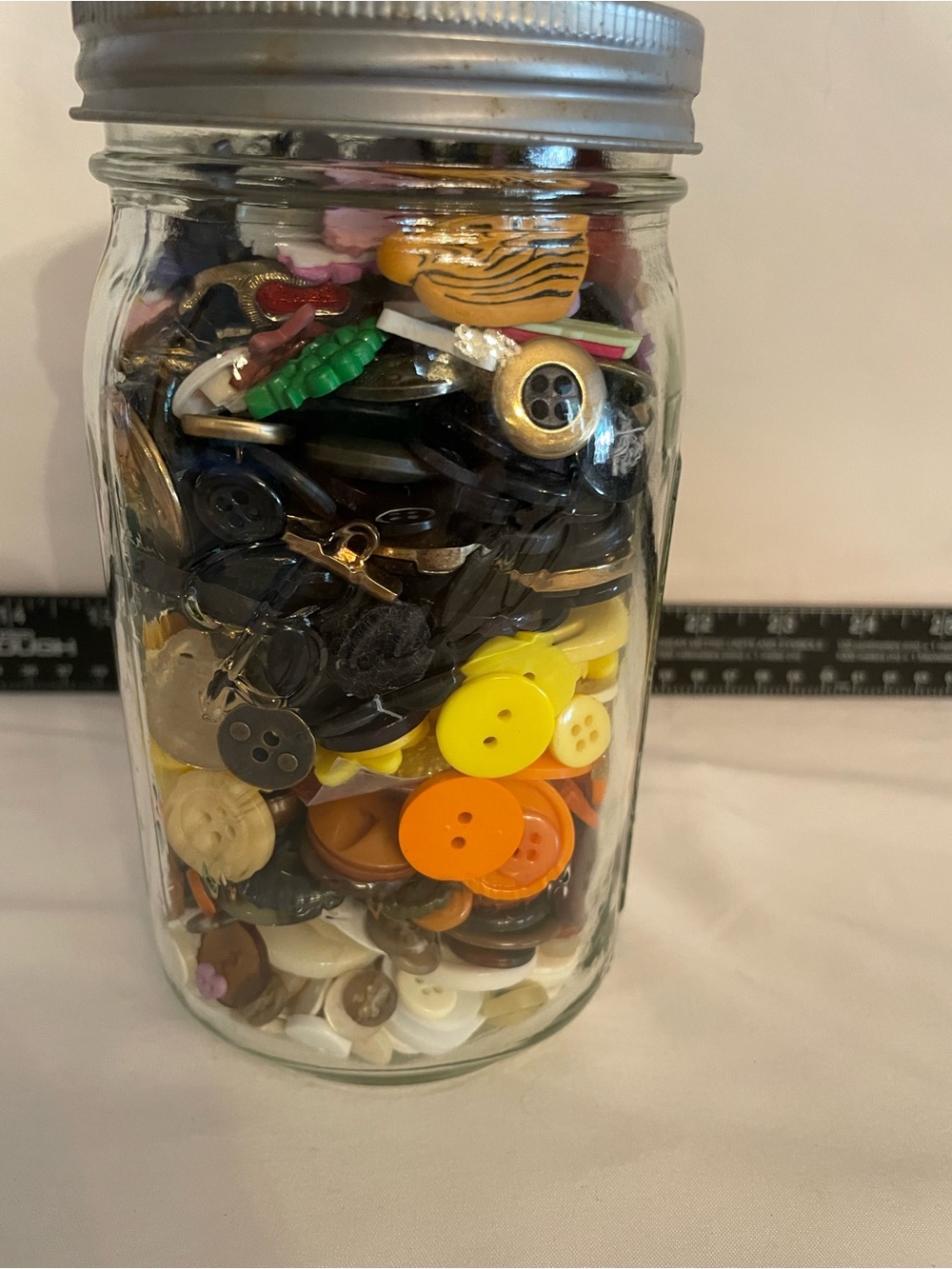Quart size jar full of buttons